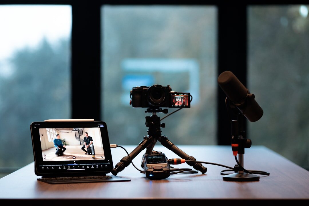 Live streaming setup with camera and laptop showing streaming software