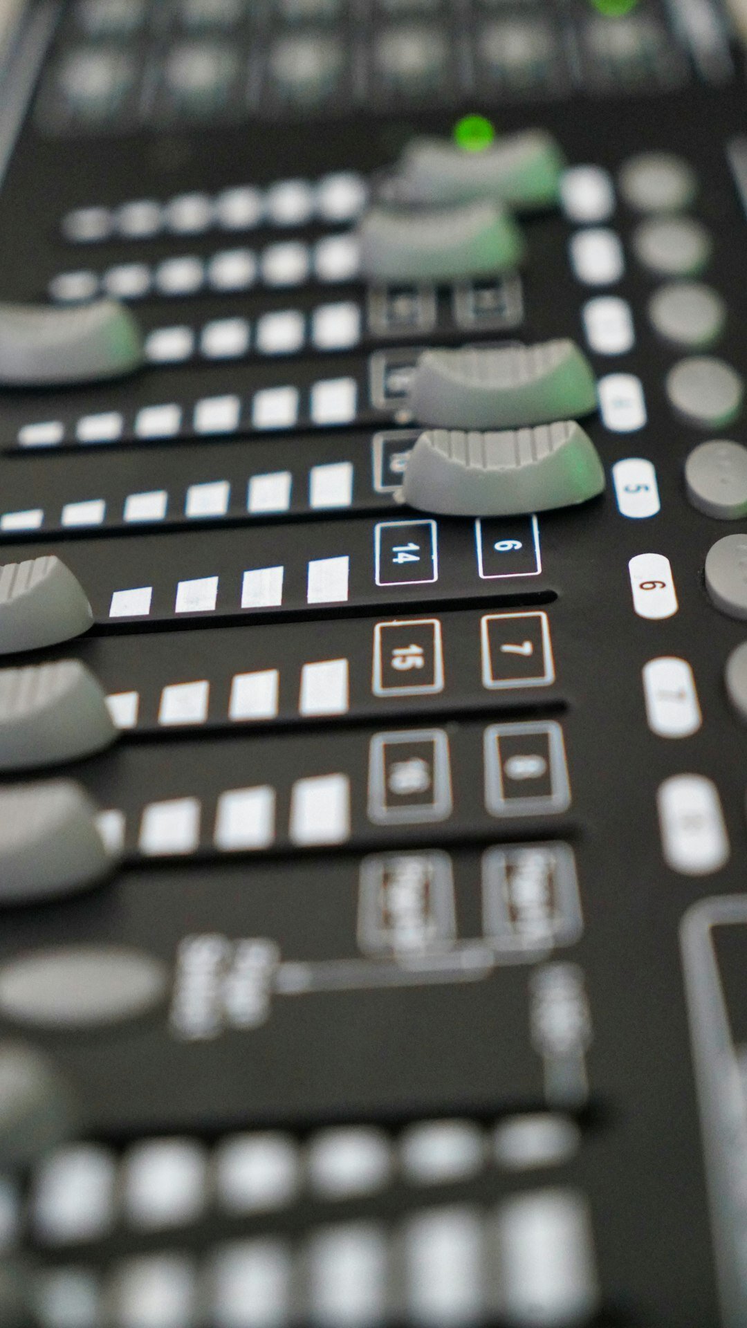 Close-up of a video vision mixer switcher panel with lit buttons